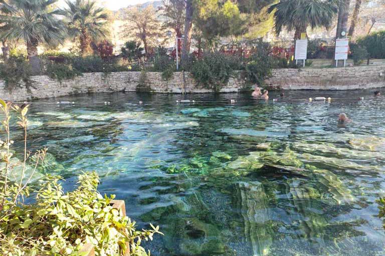 cleopatra's pool with ancient columns underwater