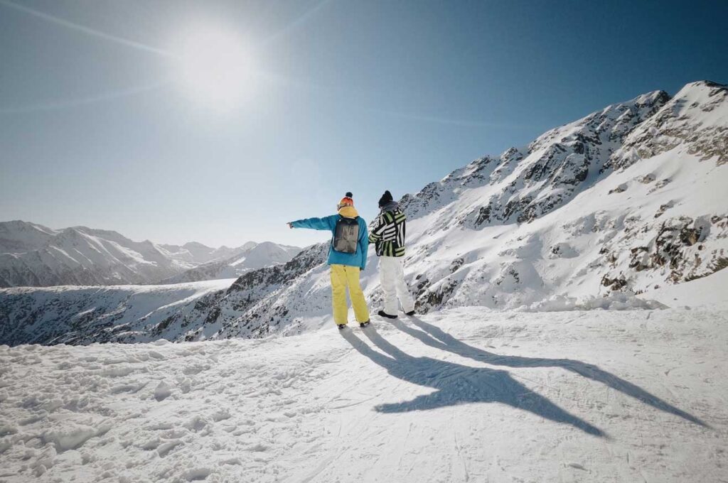Two skiers admire the winter scenery