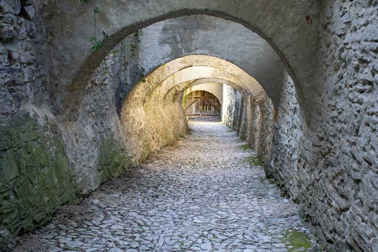 Town in Transylvania with a mystical passage of cobblestones and arches