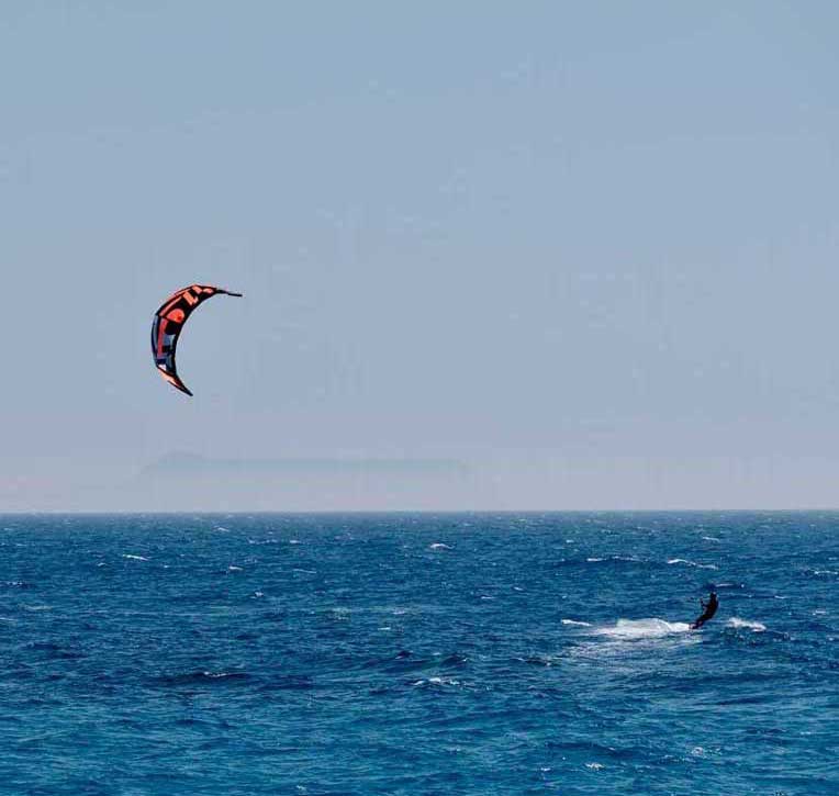 A person kiteboarding in Dhermi beach