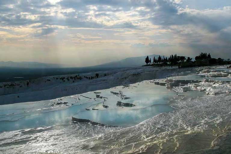 sunset reflection in the hot springs pools in Pamukkale