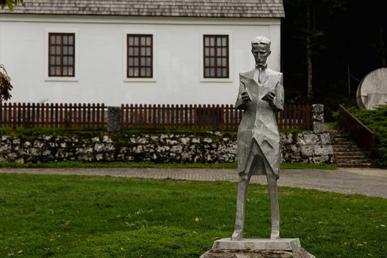 a statue of Nikola Tesla in his birthplace in Smiljan