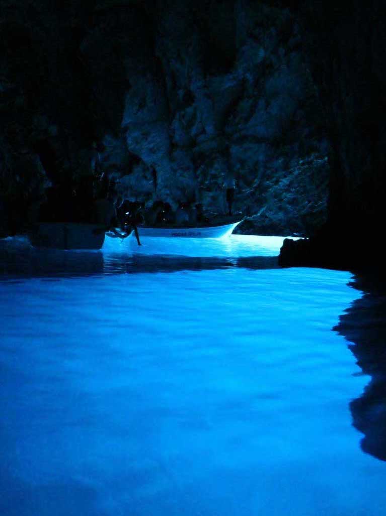 People inside the Blue cave on the Island of Bisevo