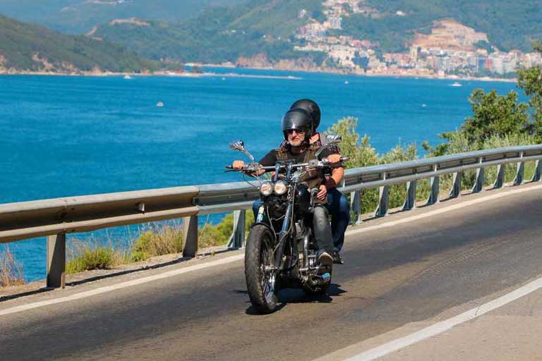 a motorist crossing Dubrovnik Montenegro by motorbike