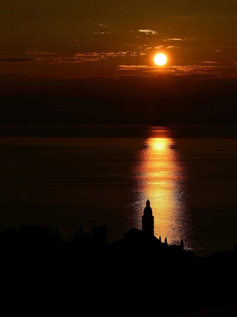 Sunset in Komiza and Church of Saint Nicholas